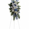 Lovely flowers such as white asiatic lilies and roses blend with blue