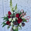 This beautiful arrangement is sure to bring Holiday cheer to anyone