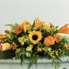 Our 24&quot; standard table centerpiece with oranges and yellows 