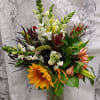 Enjoy floral gidfting with this creative arrangement of Snap dragons, sunflowers, alstroemaria