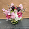 A classy low glass arrangement. Perfect gift for your loved ones.