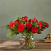 Seductive and serious, this deep crimson bouquet of roses, carnations, boxwood and