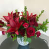 Beautiful deep red mix of Lilies, Black Pearl Roses, mini red roses