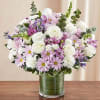 Arrangement of white roses, snapdragon and carnations, lavender daisy poms and monte