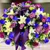&ldquo;A stunning casket spray designed to honor a beautiful life. Vibrant hues