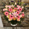 beautiful basket with gerbera Daise, roses, ucalitus, lils and altromdia