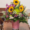 Love the combination of lilies, sunflowers and daisies to bring in the