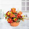 Thanksgiving Pumpkin Elegance is a stunning autumn floral arrangement beautifully presented inside