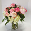 This should do the trick! A dozen roses and beautiful peonies with