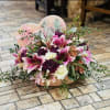 This exquisite arrangement features premium handpicked lilies, artfully placed within our signature