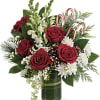 An instant Christmas party, this festive bouquet bursts with fresh blooms of