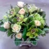 Green orchids, green hydrangea, and peach roses. Ah, it is adorable!