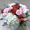 Order this precious fresh floral arrangement of roses, orchids, and hydrangea, to