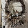 A rustic, trendy Christmas wreath. Filled with trendy chocolate taupe felt poinsettias