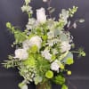 This classic white and green arrangement includes White Roses, Queen Annes Lace