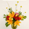 Fun and free styled seasonal blooms with funky elements.