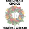 Sympathy flowers designed in a round wreath.