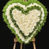 A stunning heart-shaped tribute crafted with premium white roses, soft carnations, and