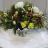 Roses, Hypericum, Alstroemeria, Seasonal Flowers, Seasonal Fancy Greens,  Decorative Ribbon.
Call the