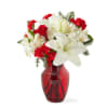 Pristine white lilies and ruby red roses are a classic holiday pairing!