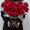 A luxurious collection of roses beautifully arranged in an elegant box.
