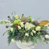 Hydrangea, roses and snapdragon with winter berries, cedar, magnolia and botanical eucalyptus