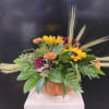 Ceramic Pumpkin Centerpiece with Sunflowers, Fall Mums, Hypericum, and Wheat.
Perfect for an
