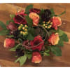 Roses, hypericum berries, scabiosa, cymbidium orchid in shades of burgundy, coral, red