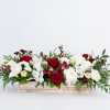 A gorgeous, full arrangement in deep reds and classic white in a