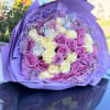 Purple and white roses hand wrapped any color wrap available.
