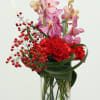 Discover the beauty of this one-of-a-kind floral arrangement. Delicate pink orchids and