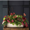 A rustic and festive design - filled with holiday greenery like Holly