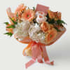 Beautiful peach and vanilla roses hydrangeas daisies and more wrapped in pretty