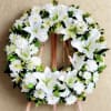 Celebrate a life with grace and dignity through this sophisticated memorial wreath.