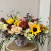 A lovely and lush Fall Flower arrangement in a vase. A mix