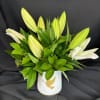 White Lilies with Green foliage.  designed in a white ceramic with