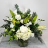 A lush creation with a multitude of white flowers, heliborous and beautiful