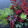 Red garden spray roses, holiday greens, ribbon that can also be worn