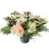 Peach roses, white spray roses, white berries, kale, hellebore and Christmas greens