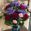 Cute bouquet of Mums and Carnations. Vase colors may vary.