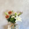 Perfect for any ocassion, 2 white Lilies, 2 delistars, spray roses and