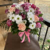 Daisies, Carnations, and Roses. This arrangement could be used for a birthday
