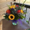 This bouquet has roses and sunflowers, and could be used for the