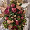 Celebrate the holiday season pretty in pink with a boxwood tree perfect