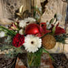 A stunning Christmas arrangement with gerbera daisies, acacia, lilies, roses, lisianthus, button