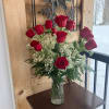 A Dozen Long Stemmed Red Roses.