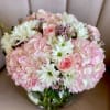 Shades of pink and white daisies. Perfect for bedside, a countertop or