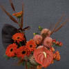 A modern floral design in rich orange and bronze tones, infused with