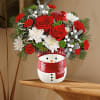 Filled with festive Christmas flowers. Frosty snowman jar
