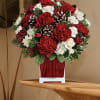 Sweet bouquet with red and white Carnations,pine cones,red berries and winter greens